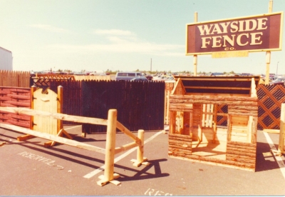 The West Babylon, NY yard featuring dog houses, wood and slatted chain link fences: 1981